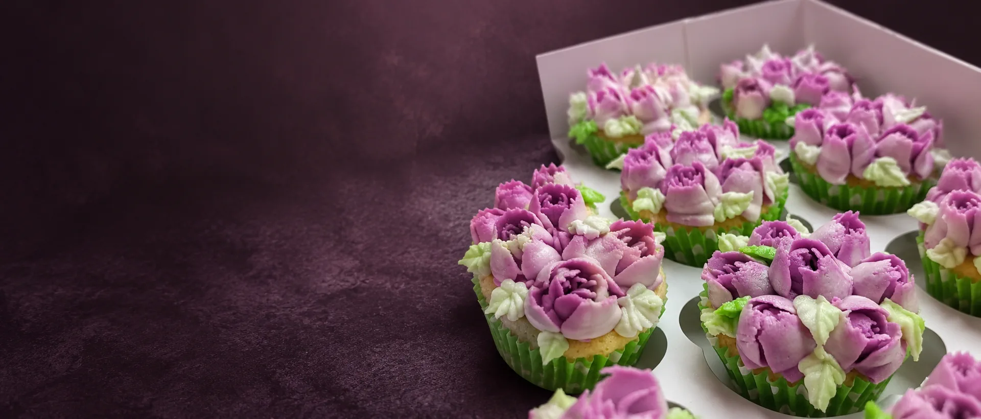 Purple floral buttercream cupcakes by Cupcake Tizzle
