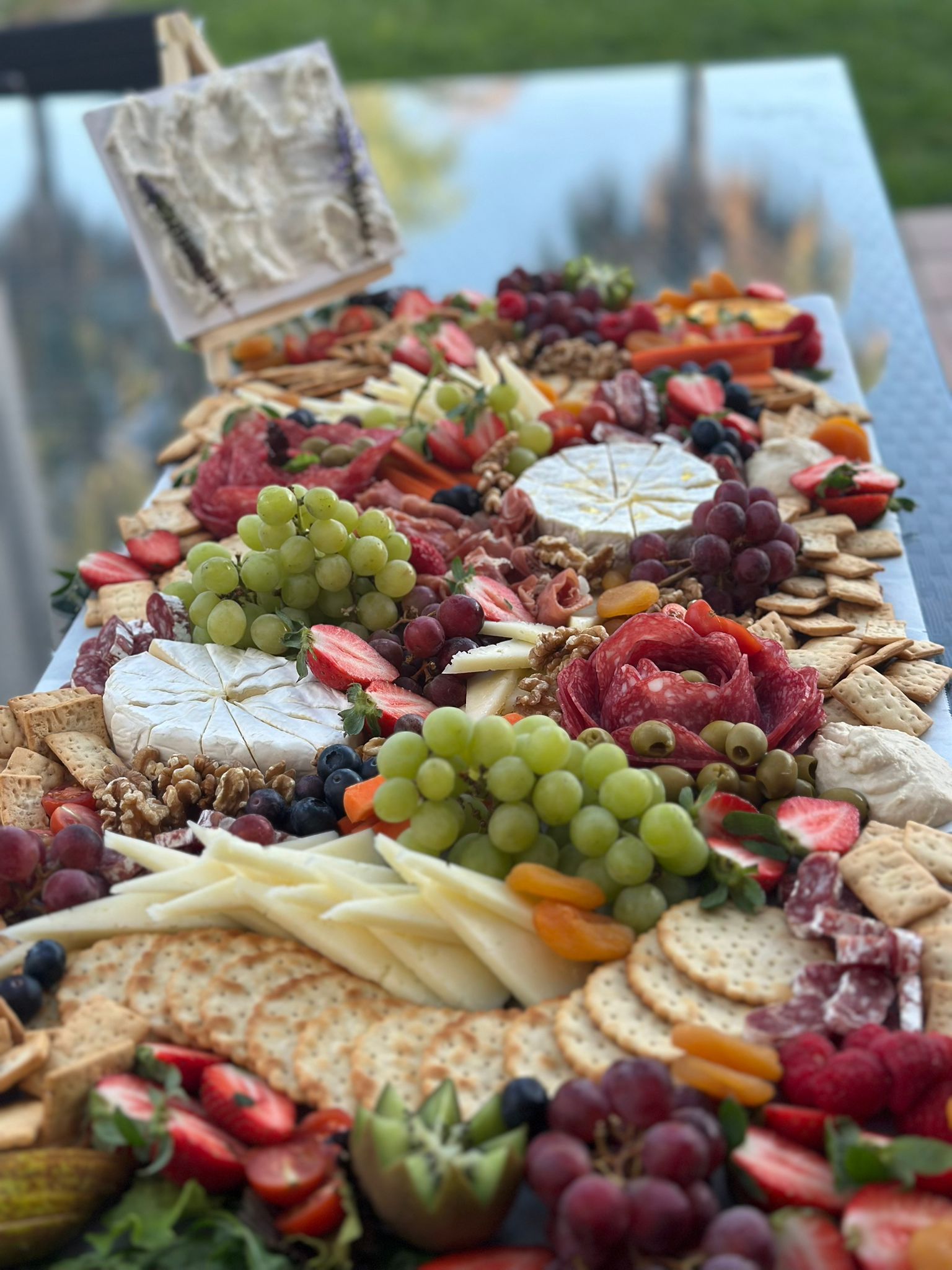 Elevate Catering grazing table with cheeses, fruit and charcuterie