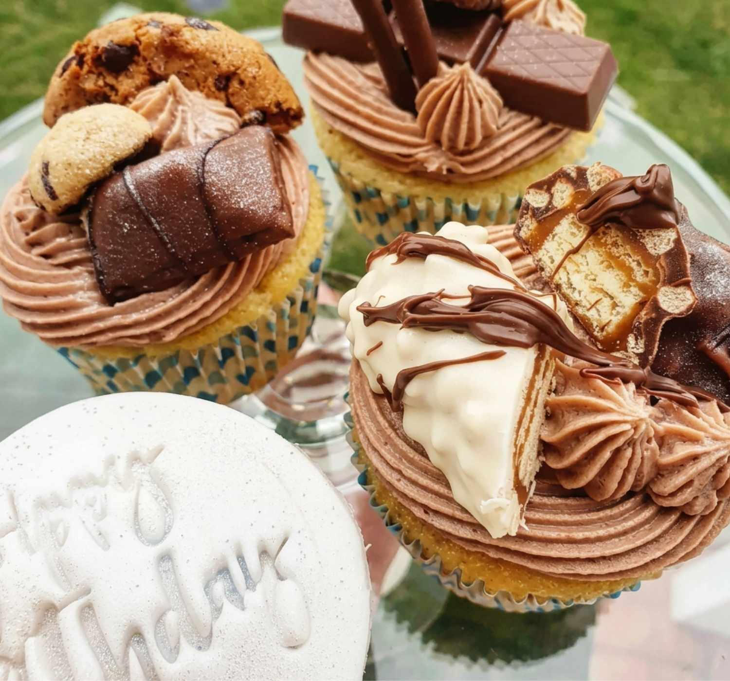 Chocolate topped cupcakes by Cupcake Tizzle